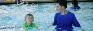 Kid swimming lessons at Excel Aquatics.